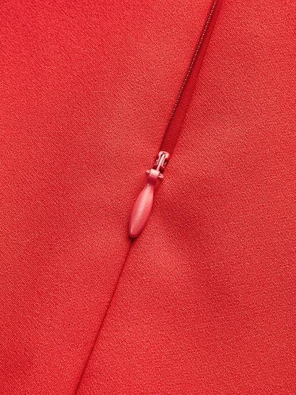 Mouwloze jurk met plissé en metalen knopen