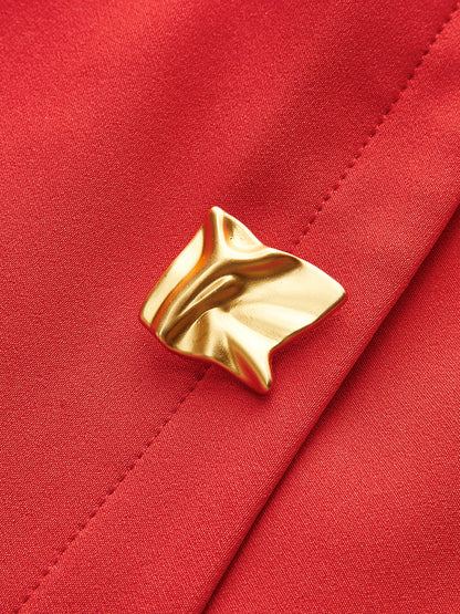 Mouwloze jurk met plissé en metalen knopen