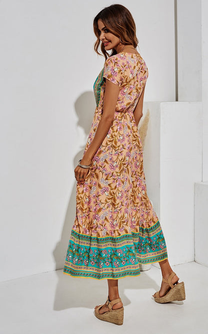 Midi-jurk met bloemenprint in turkooisgroen en perzik.