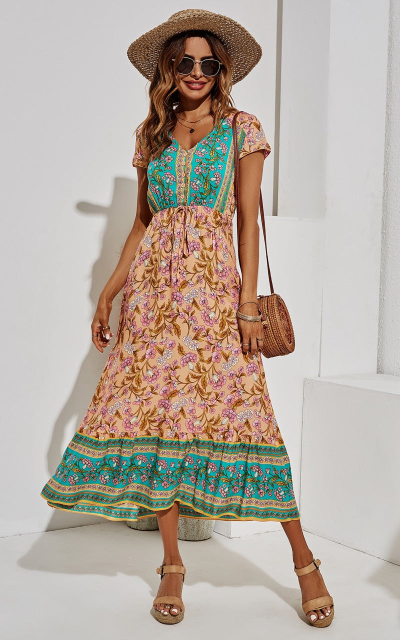 Midi-jurk met bloemenprint in turkooisgroen en perzik.