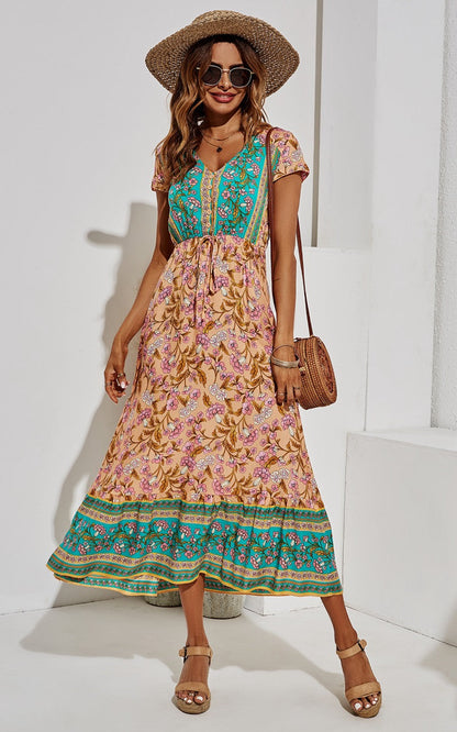 Midi-jurk met bloemenprint in turkooisgroen en perzik.