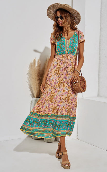 Midi-jurk met bloemenprint in turkooisgroen en perzik.